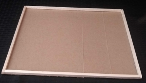 Chipboard has been glued to the underside of the rectangular base from the previous image.