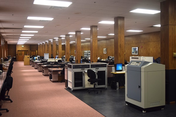 A long hallway in the IBTC showing technology on either side.