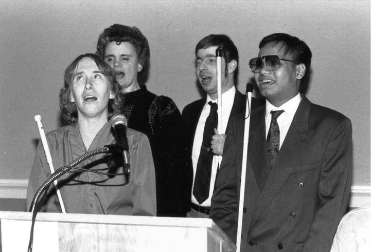 NFB singers at a podium in 1992.